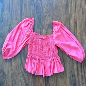 Vibrant pink top with elastic body and puff sleeves